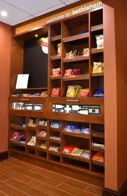 a store display of food on shelves in a room at Hampton Inn & Suites Bethlehem in Bethlehem