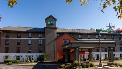 a hotel front of a building with a clock tower at Holiday Inn Express Frazer - Malvern by IHG in Frazer