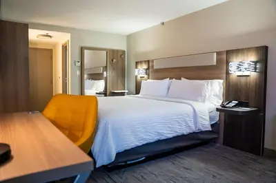 a hotel room with a large bed and a desk at Holiday Inn Express Frazer - Malvern by IHG in Frazer