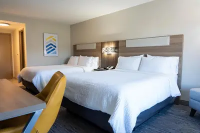 a hotel room with two beds and a table and a desk at Holiday Inn Express Frazer - Malvern by IHG in Frazer