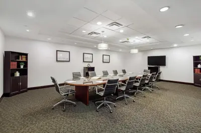 a conference room with a long table and chairs at DoubleTree by Hilton Downtown Wilmington - Legal District in Wilmington