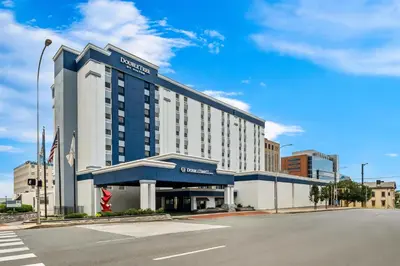 a hotel on a street with a blue sky at DoubleTree by Hilton Downtown Wilmington - Legal District in Wilmington