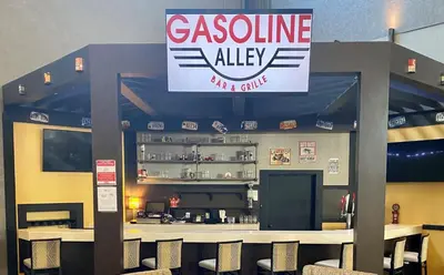 a restaurant with a sign for a cuisine ally at Holiday Inn Morgantown - Reading Area by IHG in Morgantown
