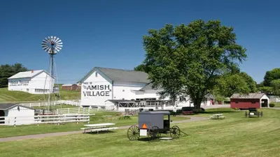 a large white barn with a windmill and a farm at Holiday Inn Morgantown - Reading Area by IHG in Morgantown