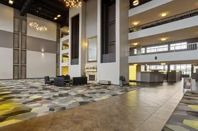 an empty lobby with chairs and a large floor at Holiday Inn Morgantown - Reading Area by IHG in Morgantown
