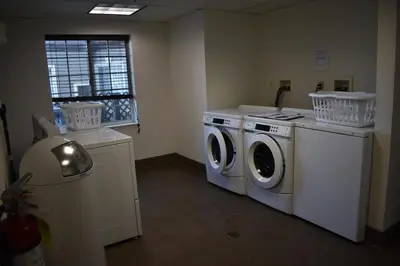 a laundry room with a washer and dryer at Staybridge Suites Cranbury - South Brunswick by IHG in Cranbury