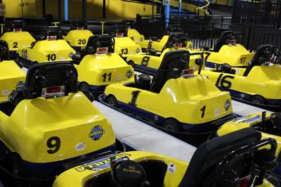 a group of yellow vehicles parked in a warehouse at Holiday Inn Express Philadelphia NE - Langhorne by IHG in Langhorne