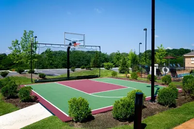 a basketball court in a park with a basketball hoop at Staybridge Suites Wilmington - Brandywine Valley by IHG in Glen Mills