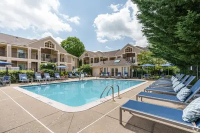 a swimming pool with lounge chairs and a resort at Avia Residences on Lincoln - Extended Stay in Malvern