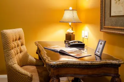 an office with a desk with a chair and a telephone at The Inn at Leola Village, a Historic Hotel of America in Lancaster