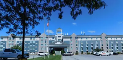 a large building with cars parked in front of it at Comfort Inn & Suites Glen Mills - West Chester in Glen Mills