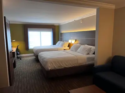 a hotel room with two beds and a window at Holiday Inn Express & Suites Williamsport by IHG in Williamsport