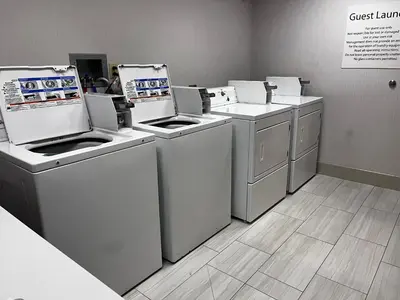 a group of washers and dryers in a store at Holiday Inn Express & Suites Williamsport by IHG in Williamsport