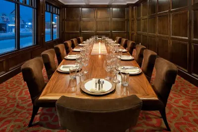 a long dining room with a long table and chairs at Holiday Inn Williamsport by IHG in Williamsport