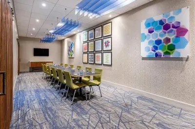 a conference room with a long table and chairs at Holiday Inn Express & Suites Ft. Washington - Philadelphia by IHG in Fort Washington