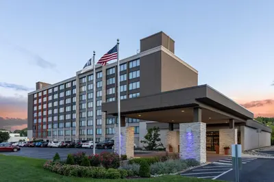 a hotel with an american flag on top of it at Holiday Inn Express & Suites Ft. Washington - Philadelphia by IHG in Fort Washington