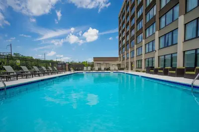 a large swimming pool in front of a building at Holiday Inn Express & Suites Ft. Washington - Philadelphia by IHG in Fort Washington