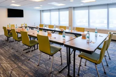 a conference room with tables and chairs and water bottles at Holiday Inn Express & Suites Ft. Washington - Philadelphia by IHG in Fort Washington