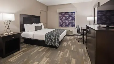 a hotel room with a bed and a desk and a television at Best Western Plus Wilkes Barre-Scranton Airport Hotel in Pittston
