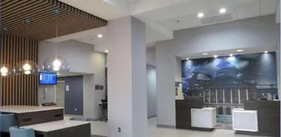 a wall with a picture of a building on it at Best Western Plus Wilkes Barre-Scranton Airport Hotel in Pittston