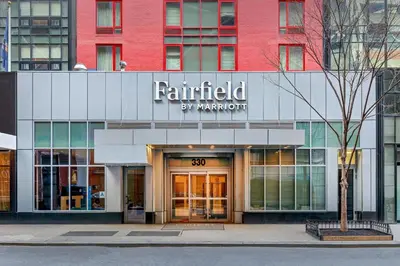 a building with a sign that reads painted by marriott at Fairfield By Marriott New York Manhattan Times Square in New York