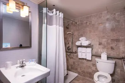 a bathroom with a toilet and a sink and a shower at Fairfield By Marriott New York Manhattan Times Square in New York