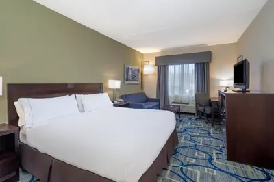 a hotel room with a large bed and a desk at Holiday Inn Express Hotel & Suites Easton by IHG in Easton