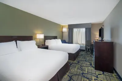 a hotel room with two beds and a television at Holiday Inn Express Hotel & Suites Easton by IHG in Easton