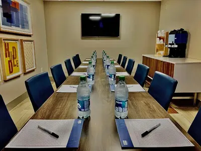 a conference room with a long table with bottles of water at Holiday Inn Express Hershey-Harrisburg Area by IHG in Hershey