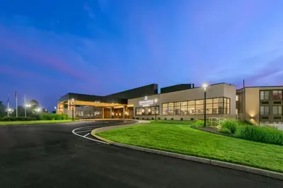a building with a road in front of it at Delta Hotels by Marriott Allentown Lehigh Valley in Fogelsville