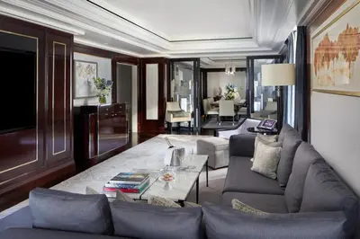 a living room with a couch and a table at The Peninsula New York in New York