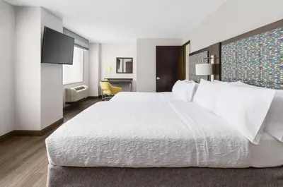 a large white bed in a hotel room at Hampton Inn Manhattan-35th St Empire State Bldg in New York