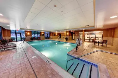 a large swimming pool in a hotel lobby at Hampton Inn & Suites Chadds Ford in Glen Mills
