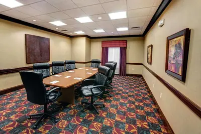 a conference room with a wooden table and chairs at Hampton Inn & Suites Chadds Ford in Glen Mills