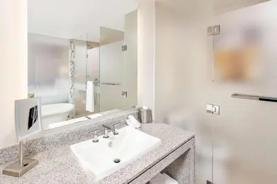 a bathroom with a sink and a mirror at Hilton Club West 57th Street New York in New York