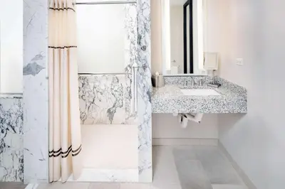 a bathroom with a sink and a shower at Hilton Club West 57th Street New York in New York