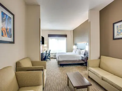 a hotel room with a bed and a bedroom at Holiday Inn Express Hotel & Suites Bethlehem by IHG in Bethlehem