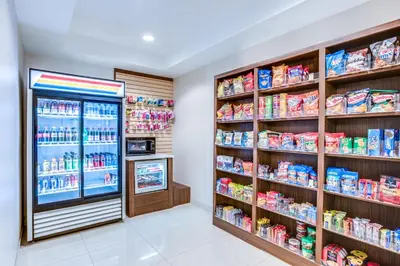 a grocery store aisle with a soda refrigerator at Holiday Inn Express Hotel & Suites Bethlehem by IHG in Bethlehem