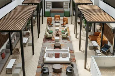 an overhead view of a lobby with tables and chairs at Embassy Suites by Hilton Philadelphia Valley Forge in Wayne