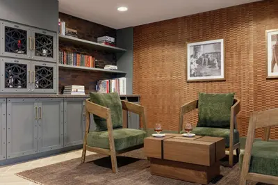 a living room with two chairs and a table at Embassy Suites by Hilton Philadelphia Valley Forge in Wayne