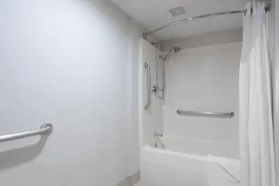 a white bathroom with a shower and a toilet at Holiday Inn Express Ramsey Mahwah by IHG in Ramsey