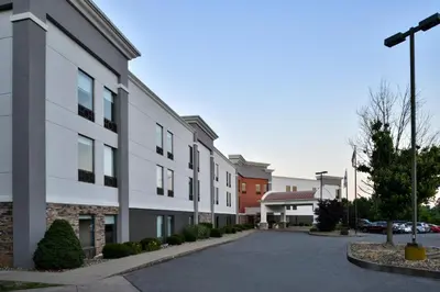 a rendering of a building with a parking lot at Holiday Inn Express Lewisburg - New Columbia by IHG in New Columbia