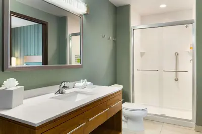 a bathroom with a sink and a shower and a toilet at Home2 Suites by Hilton Downingtown Exton Route 30 in Downingtown
