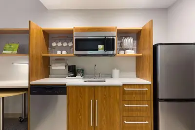 a kitchen with a microwave and a refrigerator at Home2 Suites by Hilton Downingtown Exton Route 30 in Downingtown