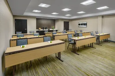 a classroom with desks and chairs in a room at Courtyard by Marriott Philadelphia Montgomeryville in North Wales