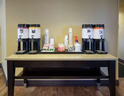 a table with a group of coffee machines on it at Hampton Inn Hazleton in Hazleton