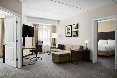 a hotel room with a bed and a couch and a desk at Residence Inn by Marriott Philadelphia Langhorne in Langhorne