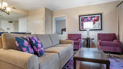 a living room with a couch and two chairs at Bluegreen Vacations Suites at Hershey in Hershey