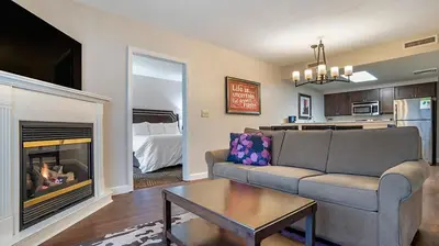 a living room with a couch and a fireplace at Bluegreen Vacations Suites at Hershey in Hershey