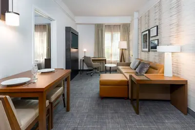 a living room with a couch and a table at Residence Inn Wayne in Wayne